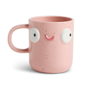 Front facing view of a pink speckled character mug. The mug's handle is to the left. The mug is named Lacy Pink Hostess and has a smiling face on her front.