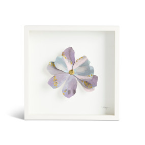 Front view of a white square shadow box. There is a large sculpted purple flower at the center,