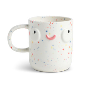 Front facing view of a white character mug that has red and blue speckles. The mug's handle is to the left. The mug is named Parker Pet Parent and has a smiling face on her front.