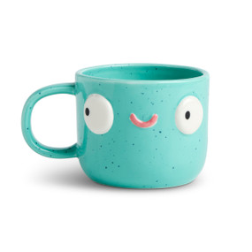 Front facing view of a teal green character mug that has dark blue speckles. The mug's handle is to the left. The mug is named Quinn Athlete and has a smiling face on his front.