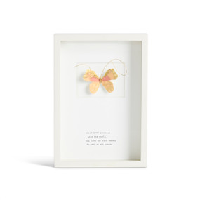 Front facing view of a white rectangular shadow box. At the top is a sculpted gold yellow and coral butterfly with paler yellow markings. "Share your goodness with the world. You have too much beauty to keep it all inside." is printed in typeface centered at the bottom.