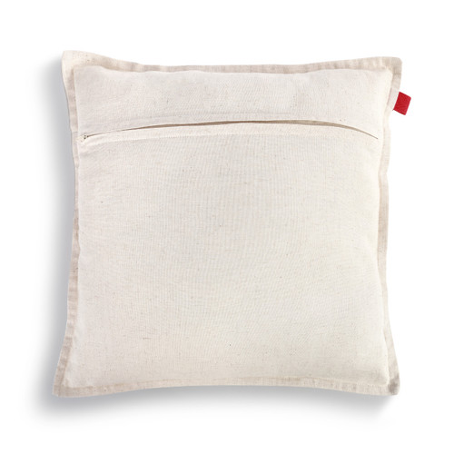 The back of a white square pillow with a small red tag.