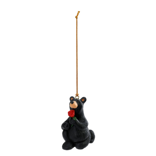 Black bear ornament on bended knee holding a rose in proposal