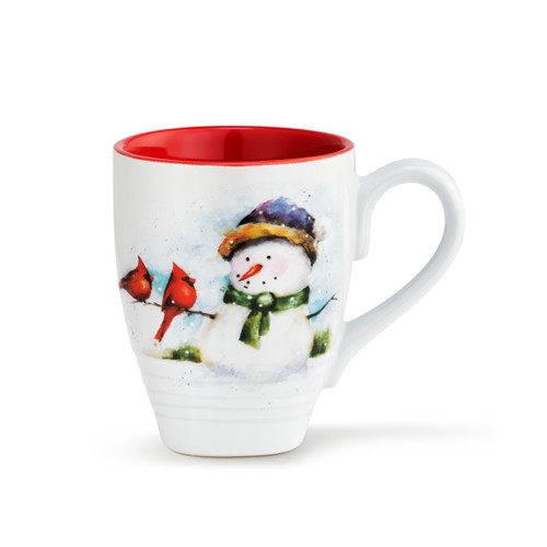 The front of a white coffee mug with a red inner lining, and a watercolor painted image of a snowman holding two red cardinals painted on the front.