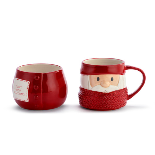 Front view of a red stoneware set of a bowl and mug shaped like Santa wrapped in a red scarf. There is a white patch on the bowl that says "Don't Stop Believing".