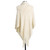 The backside of a soft cream poncho, textured with an assortment of lined patterns, and with a fringed bottom edge. Placed on a black and white mannequin.