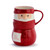 Red stoneware stacked set of a bowl and mug on top shaped like Santa wrapped in a red scarf. There is a white patch on the bowl that says "Don't Stop Believing".