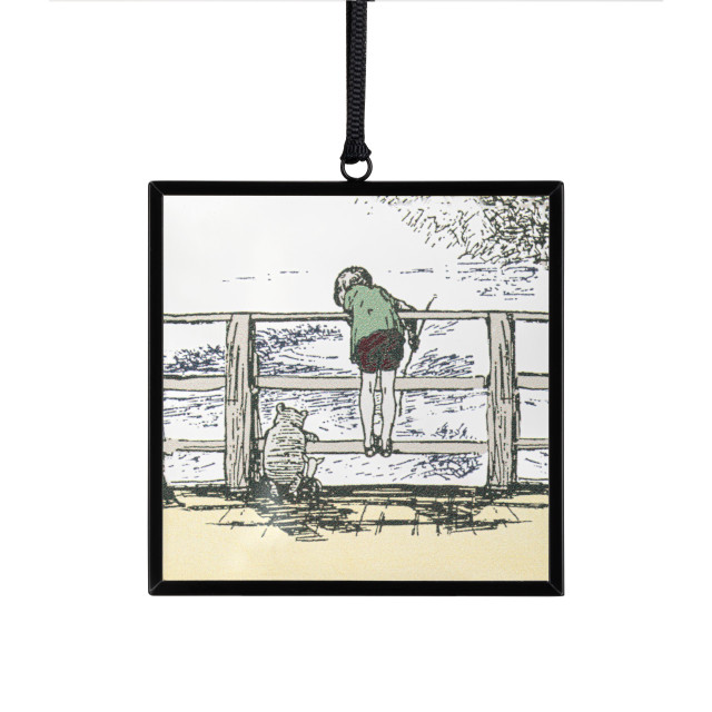 A small square sun catcher with a classic illustration of Christopher Robin and Pooh looking over the bridge at the water.
