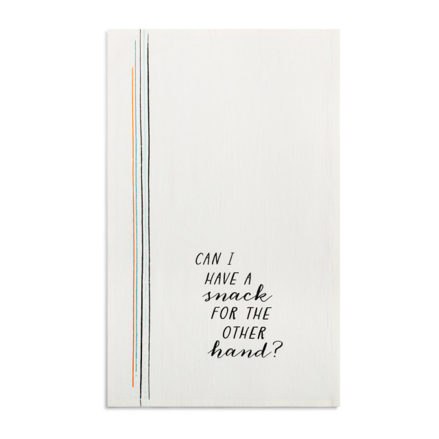 A white kitchen towel with the saying 