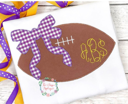Football with bow zig zag applique Football with bow zig zag applique