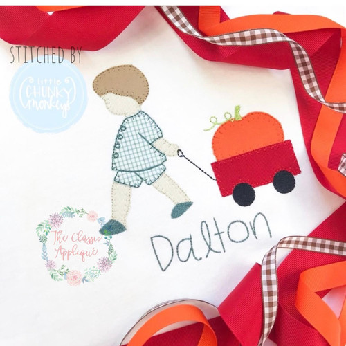 Boy pulling wagon with pumpkin applique Boy pulling wagon with pumpkin applique