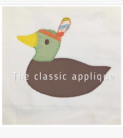 Mallard duck with feather headdress blanket stitch applique Mallard duck with feather headdress blanket stitch applique