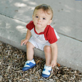 Baby boy wearing Ro+Me Alex Baby Shoes in Navy