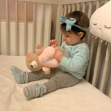 Baby girl wearing Ro+Me Stan Baby Booties in Turquoise
