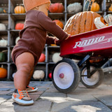 Baby boy wearing Wild Animals Soft Soles in Brown, sitting down