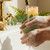 Hands washing with Aloe Vera & Clover handmade soap bar, creating a creamy lather under warm running water.