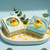 Handcrafted Duckling Clean soap — eucalyptus + shea butter bar with rubber duck embed on white tray with mini duck decorations.