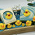 Duckling Clean handmade soap with rubber duck embed, boxed and unboxed, displayed with mini duck toys and decorative florals.
