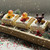 Wooden tray display of Jingle Suds kids’ soaps featuring Santa duck, reindeer, and snowman; handmade Christmas bath gift idea.