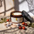 Beach Bum rosehip oil body lotion with beach-inspired styling, nourishing summer body moisturizer in amber jar with seashells and botanical accents