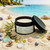 Beach Bum body lotion styled on a tropical beach with seashells and sea glass, summer scented rosehip oil body lotion, nourishing hydrating skincare