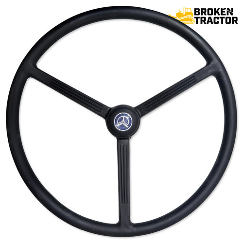 Steering wheel with center cap for Ford 1910 compact tractor, part number SBA334300010