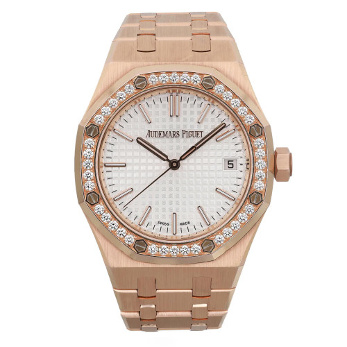 An image of a pre-owned men's luxury wristwatch by Audemars Piguet, displayed in a front full frontal view. The watch features a silver tapisserie-patterned dial with luminous hands, encased in a rose gold octagonal case. The bezel is adorned with diamonds and made of rose gold and the band is also made of rose gold. The watch is in good condition and showcases a classic, elegant style.