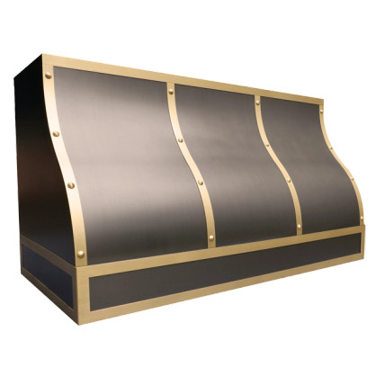 Carlsbad Bloom Range Hood: A handcrafted metal box-shaped range hood that makes a dramatic statement with contrasting polished accents. Custom-made with Artisanal Craftsmanship to be the culinary centerpiece of your kitchen.