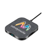 A square wireless charger in grey fabric with a black base, featuring a logo on the surface.