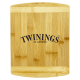 A bamboo cutting board with a smooth surface, featuring a logo. Its natural wood colour adds a warm touch.