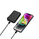 A black power bank connected to a smartphone displaying a battery charge level on the screen.