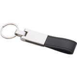 A silver key ring with a black faux leather strap and a shiny metal attachment.