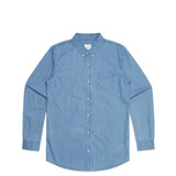A blue denim shirt featuring a buttoned front and a single chest pocket. The shirt has long sleeves and a classic collar.