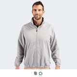 A full zip jacket in light grey worn by a male model, featuring a collar and elastic cuffs. It has a logo.