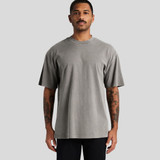 A grey heavy faded t-shirt featuring a relaxed fit and short sleeves, worn by a model.