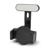 A black wireless charging phone holder with a sleek design and a reflective surface on top.
