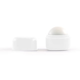 A white cube lip balm with a round top, featuring a removable lid. Simplistic design with no visible branding.