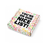 A gift box featuring festive designs in red, green, and gold, with a prominent black text message.