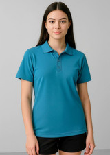 A short sleeve polo in teal colour featuring a collar and three buttons, worn by a model with long hair.