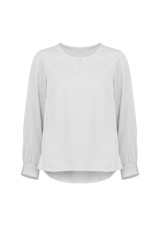 A women's long sleeve blouse in a soft white colour with a round neckline and button detail. It features a relaxed fit.