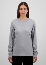 A long sleeve women's tee in grey, featuring a round neckline and a fitted design. It has a logo on it.