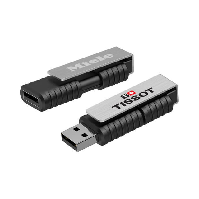 A silver and black flash drive featuring a textured design and logos, with USB-C and USB-A connectors.