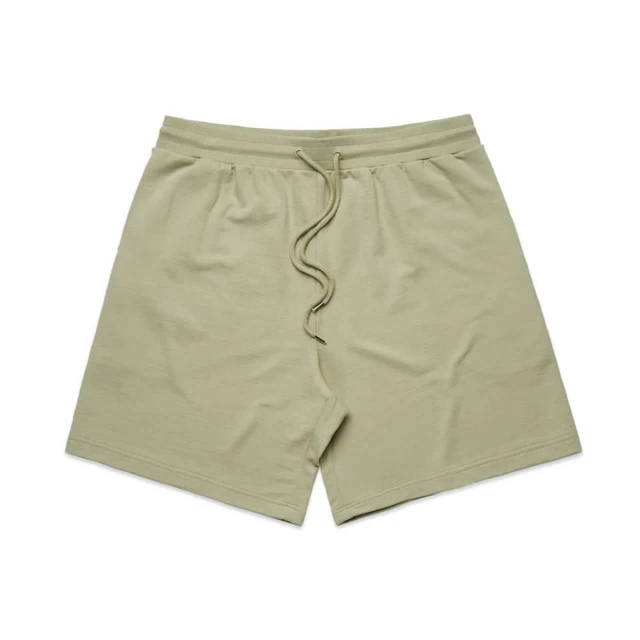 A pair of light green sports shorts featuring an elastic waistband and a drawstring. Includes a logo.