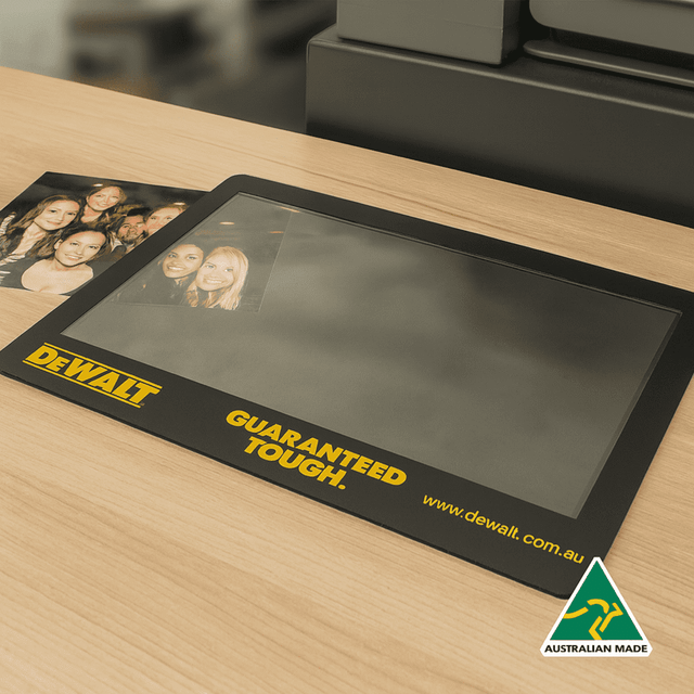 A black framed insert counter mat made of natural rubber, featuring a logo and an Australian Made emblem.