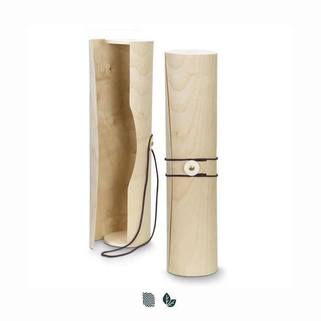 A wooden wine tube in natural light wood, featuring a leather tie and an internal compartment. It also has a logo.