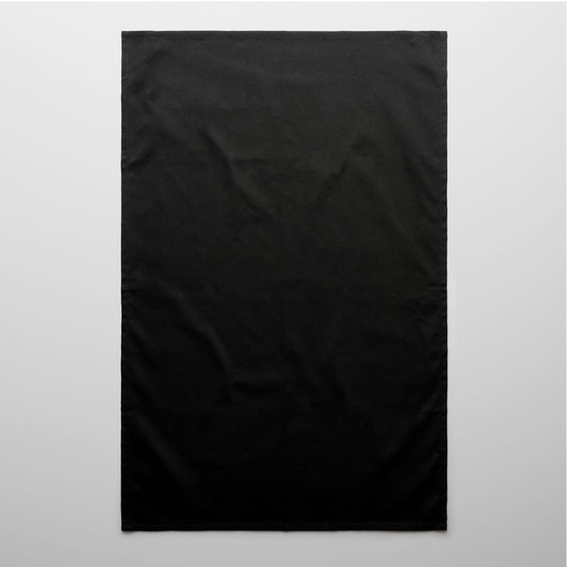 A black tea towel featuring a plain design and a small logo in the corner.
