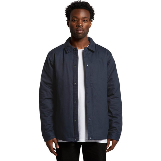 A navy work jacket featuring a button-up front and a collar, worn by a model against a plain background.
