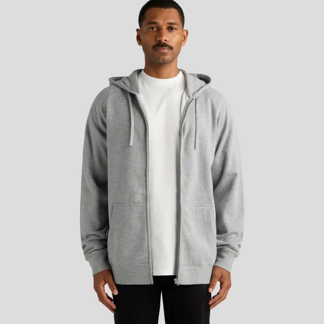 A grey zip-up hoodie with a front opening and two pockets, worn by a male model. It includes a hood and long sleeves.