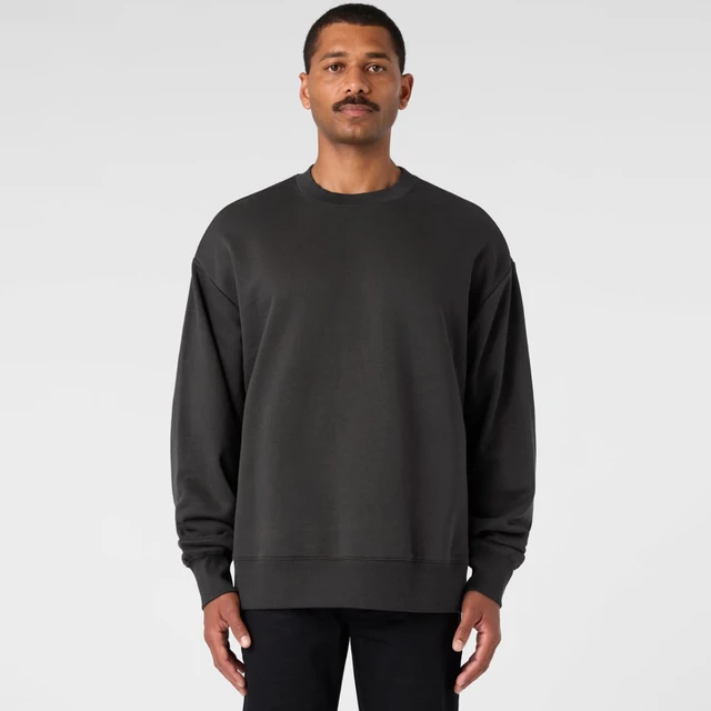 A dark grey sweater with a relaxed fit, featuring long sleeves and a crew neckline. It has a logo on it.