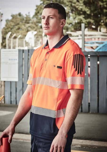 A high-visibility short sleeve polo in bright orange and navy, featuring segmented reflective tape and a logo.